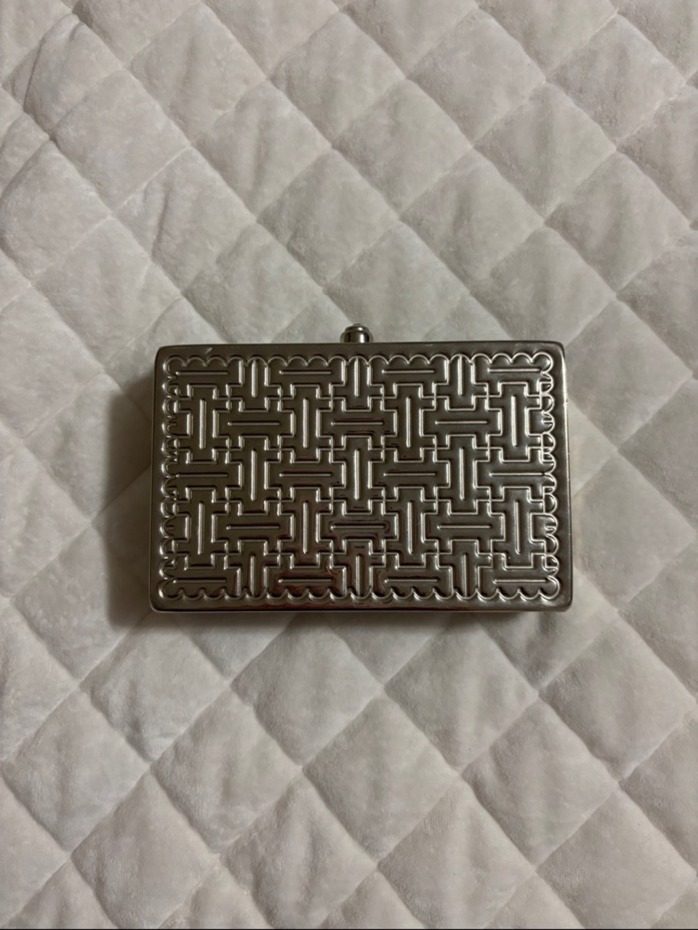 Silver Embossed Metal Clutch by Sasha